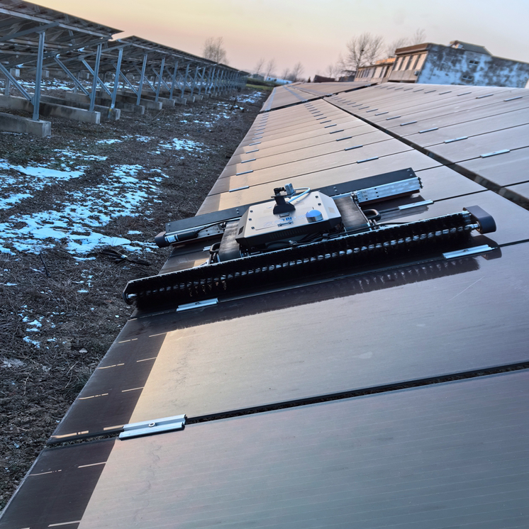 A robot working on a tilted solar panel